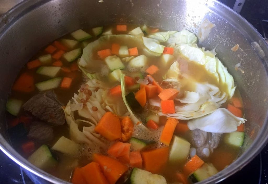 Cooking palm wheat stew